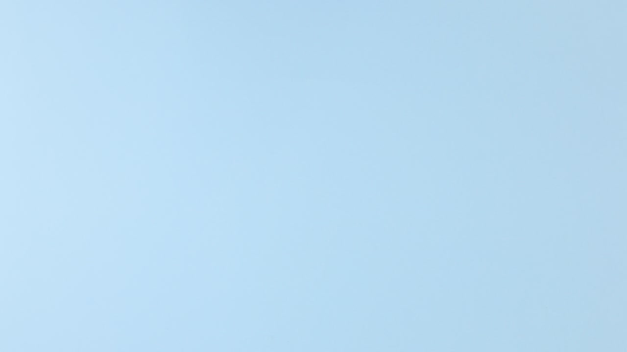 Pineapple rolling on pastel blue theme. Stop motion