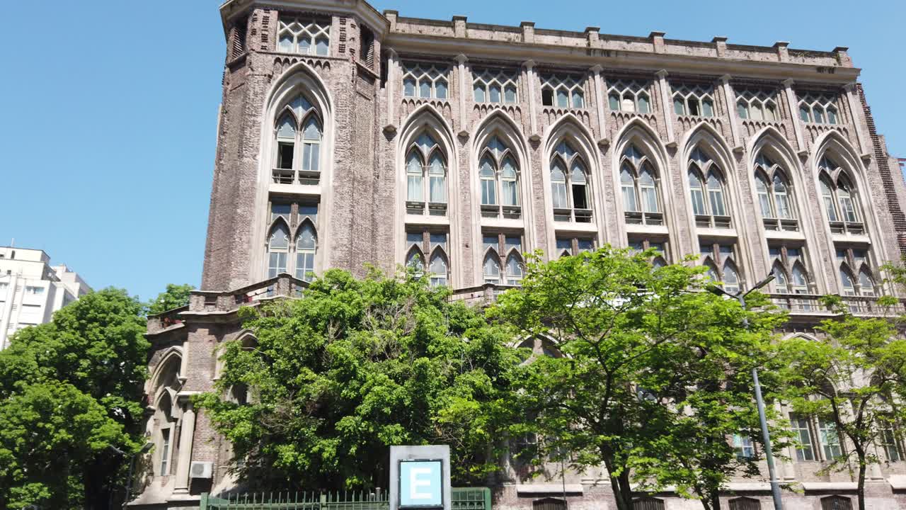 Entrance facade of Neo Gorhic Building University of Engineering at Buenos Aires Argentina urban green city park at Daylight