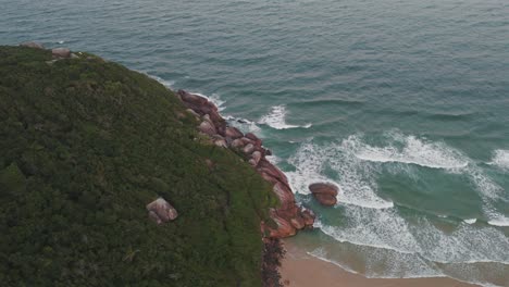 a rocky hill protruding into the atlantic ocean along the coast of brazil