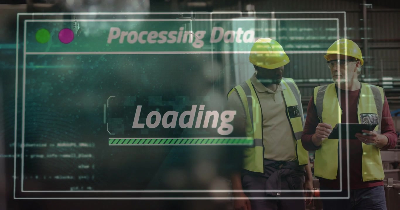 Two workers walking plant aisle, tapping tablet and initiating HUD reading Processing Data Loading