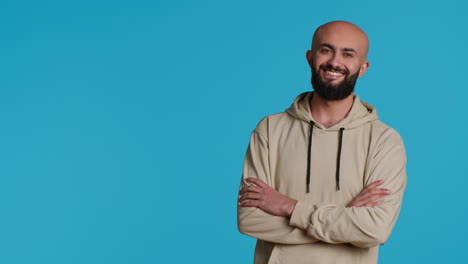 Middle-eastern-confident-person-posing-on-studio-camera