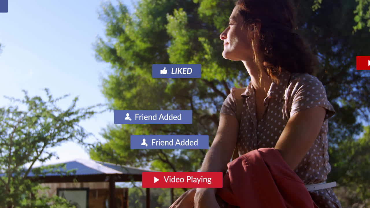 woman holding red jacket sitting under pavilion, displaying floating social media notifications