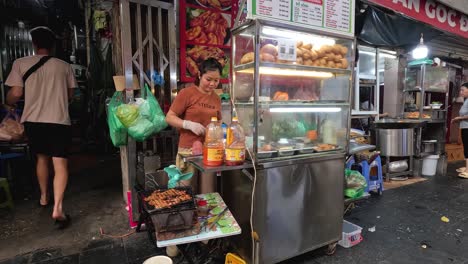 customer buying banh mi from street vendor