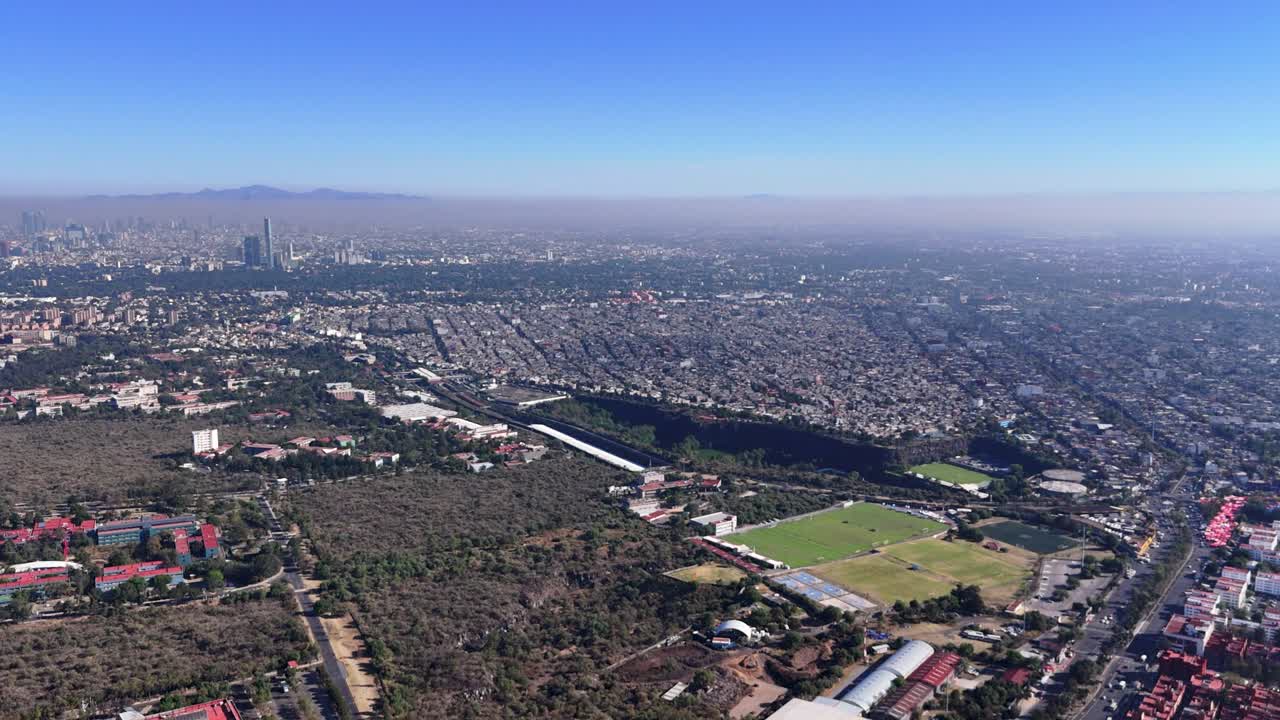 Overhead shot of Mexico City covered in smog during the morning
