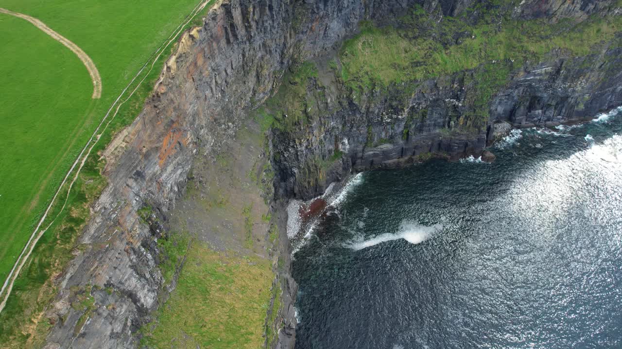 Cliffs of mother aerial view of the steep Cliffs and Atlantic Ocean below Ireland epic Locations
