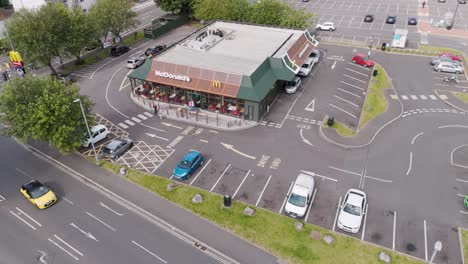 aerial view of a mcdonald's restaurant with drive-thru and parking lot