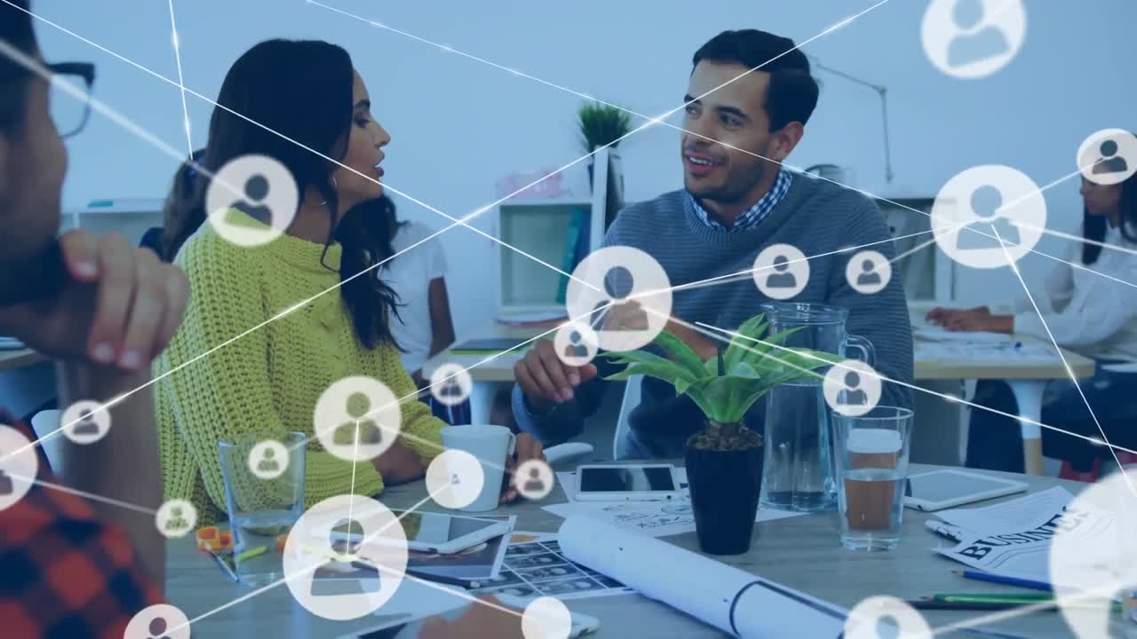 Animation of connected profile icons over diverse coworkers with tablet and coffee sharing ideas