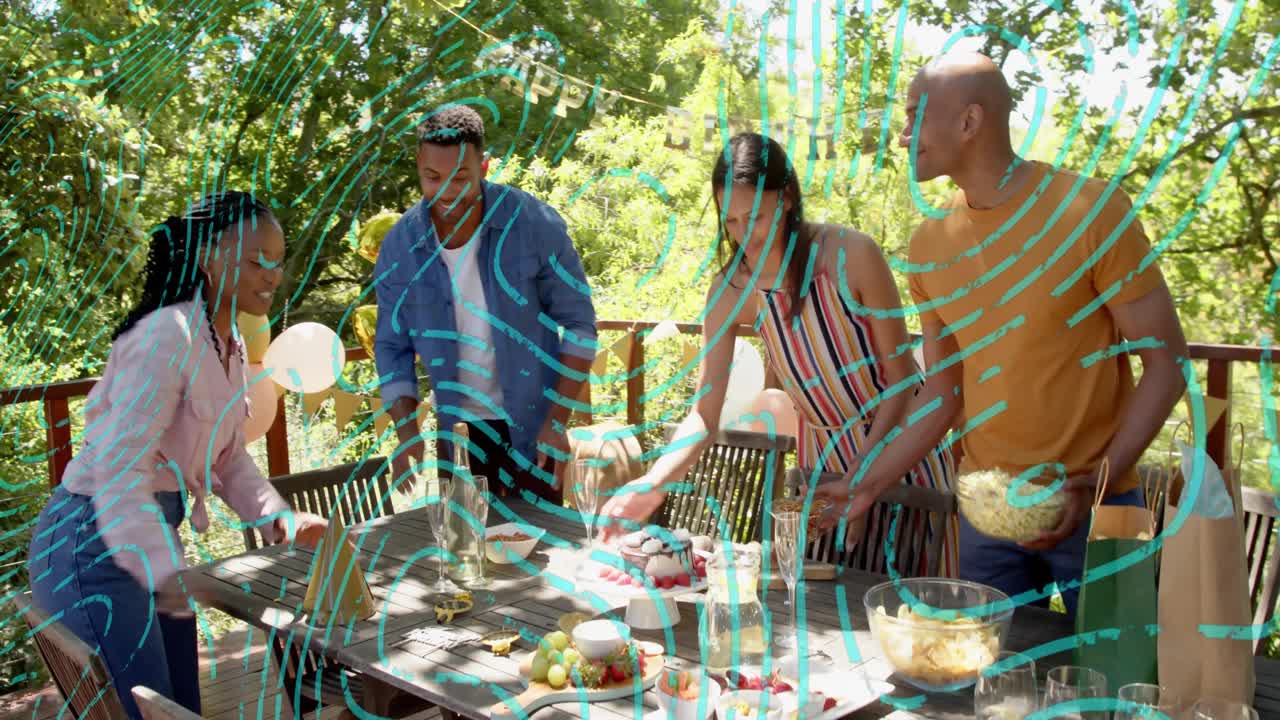 Group of four adults arranging table on deck preparing for celebration, animated tags guiding cake