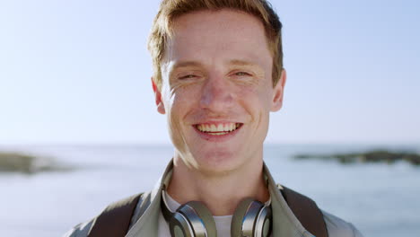 face, headphones and man on beach