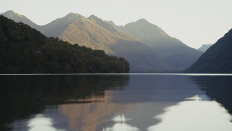 serene mountain lake at sunrise/sunset