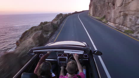 couple driving convertible car cabriolet cape town south africa steadicam shot