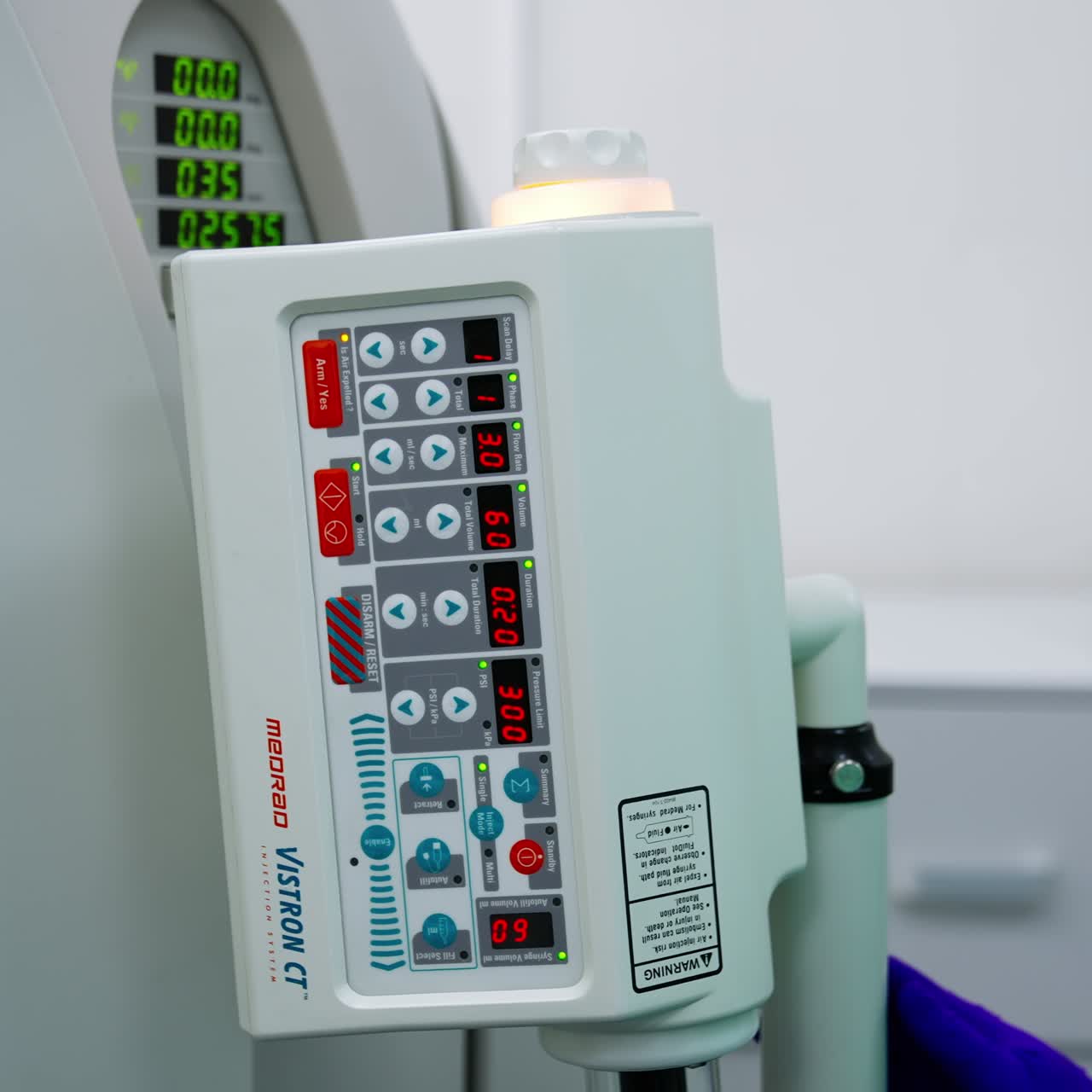 Pressing the buttons on the equipment control panel. Lab technician turns on the magnetic resonance scanner