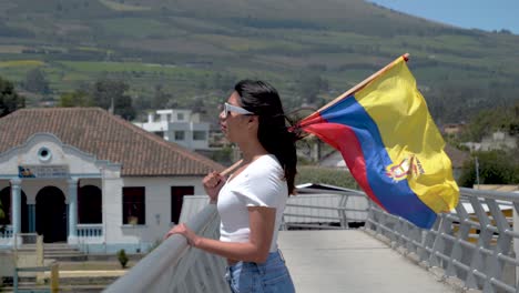 patriotic latin american woman waving flag from ecuador hopeful looking into distance