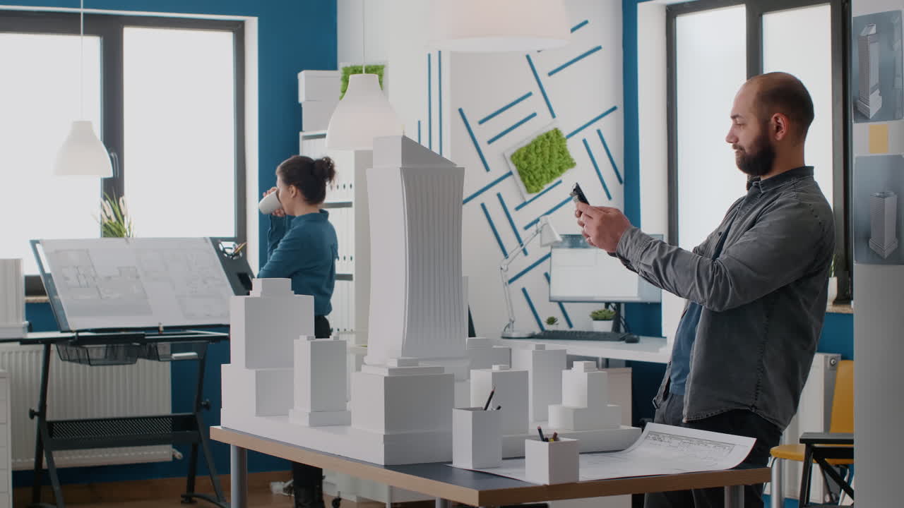 Architects working on a building model in an office