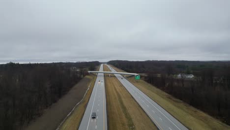 overtake shot of motorway middle of green nature in warren, ohio, usa