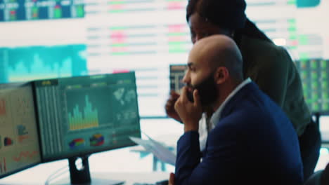 diverse business analysts working to evaluate costs and create a projection