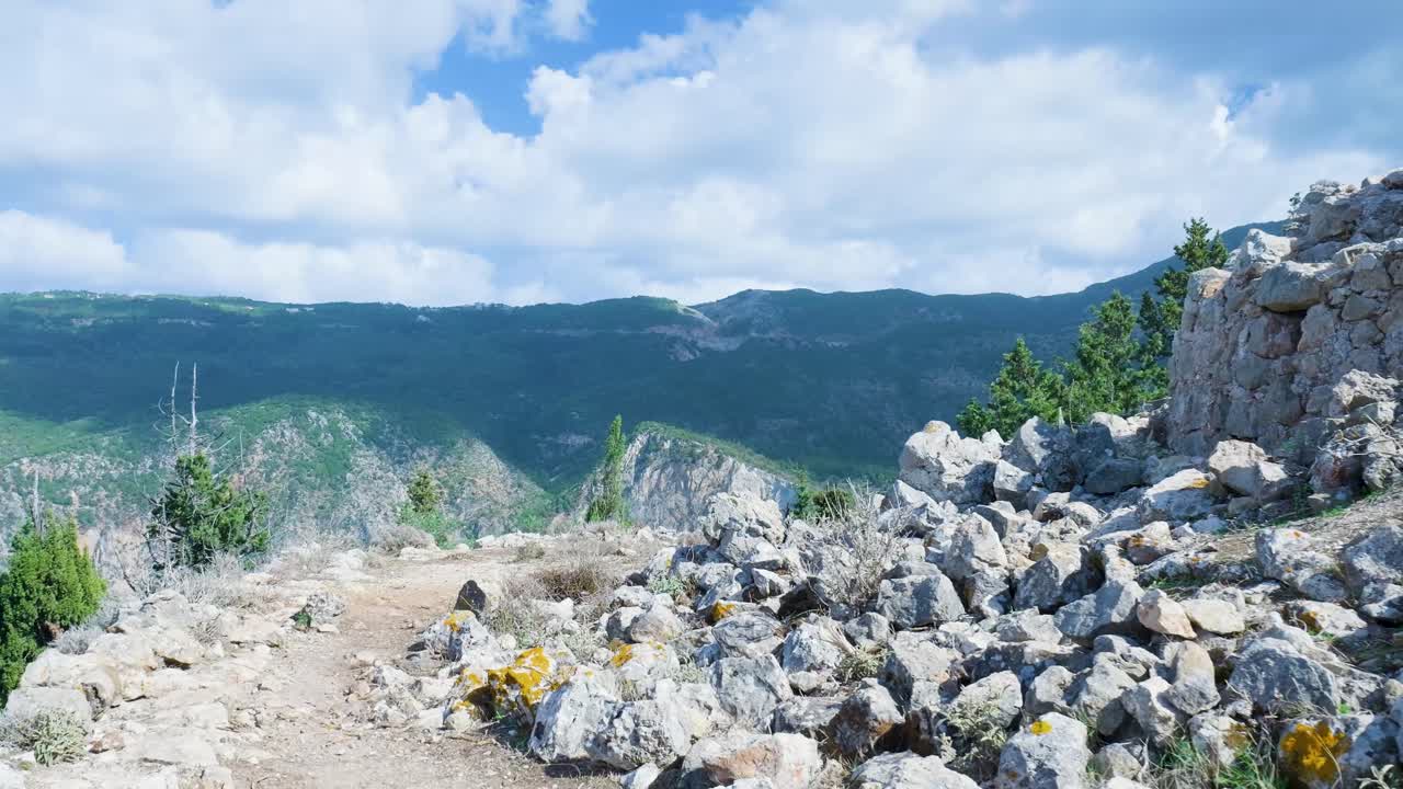 Mountainous Landscape with Ruins and Coastal Views