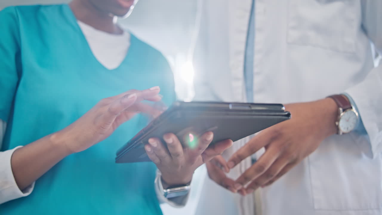 Doctor, hands and tablet in teamwork