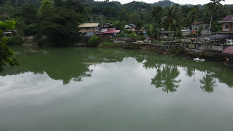 Drone-village-panoramic-Loboc-river-Philippines-humble-village,-tropical-island-delta-coastline