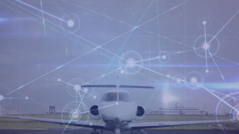 animation of lens flares and connected dots over parked airplane against sky in airport