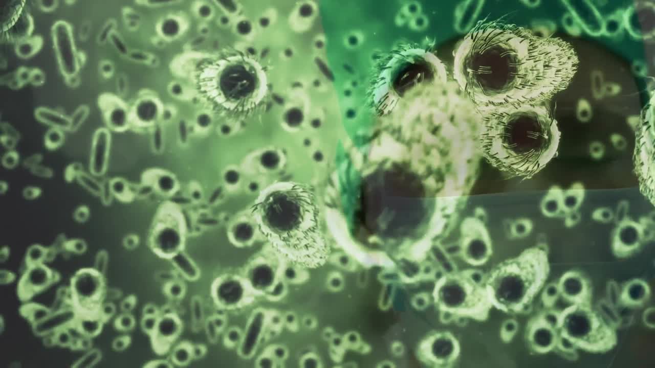 Animation of covid 19 cells floating over surgeon in face mask