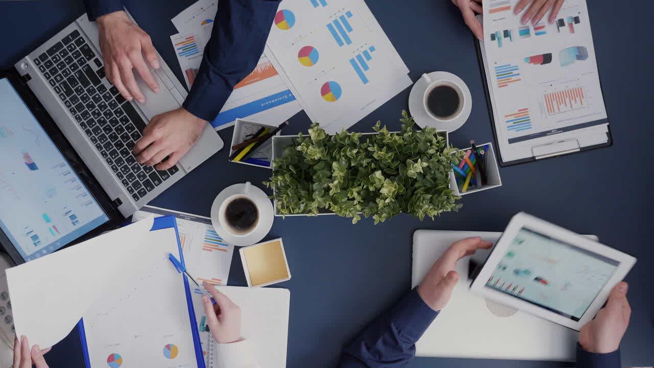 Top view timelapse of business teamwork working analyzing company ...