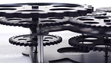 close up shot of  black gear cogs rotating