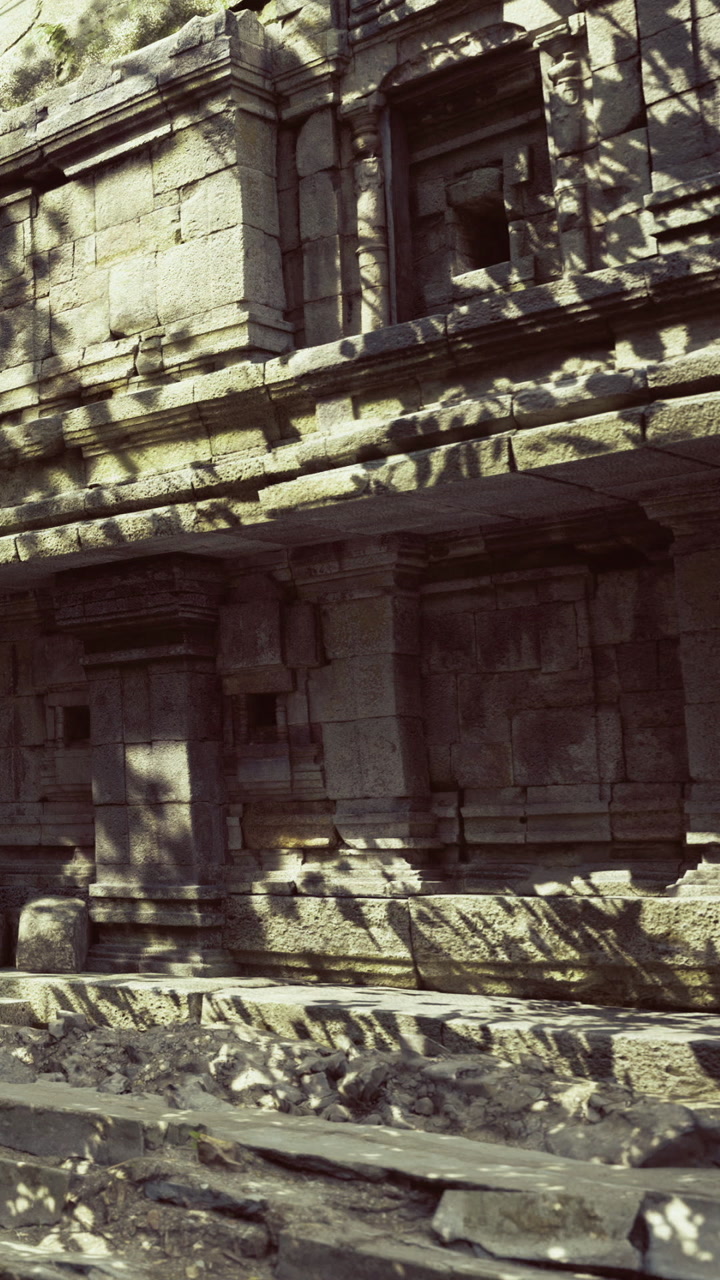 Ancient stone structure filled with shadows on a sunny day near ruins