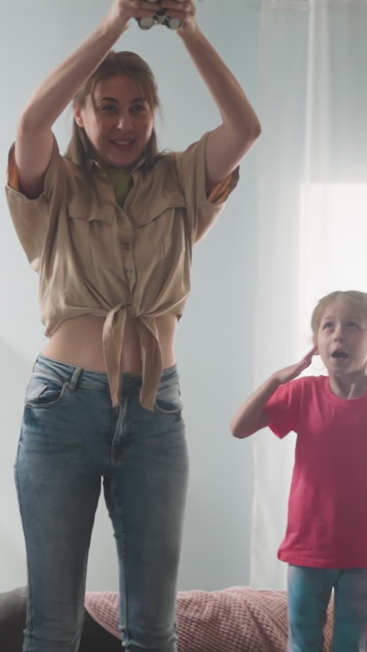 Children looks with beating hearts at mother preparing to break piggy bank standing high on sofa slow motion. Check up cash savings. Happy family attraction