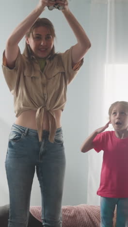children looks with beating hearts at mother preparing to break piggy bank standing high on sofa slow motion. check up cash savings. happy family attraction