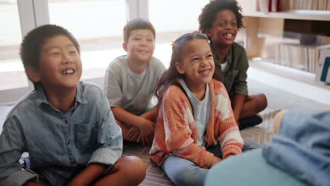 children listening to a story in the classroom