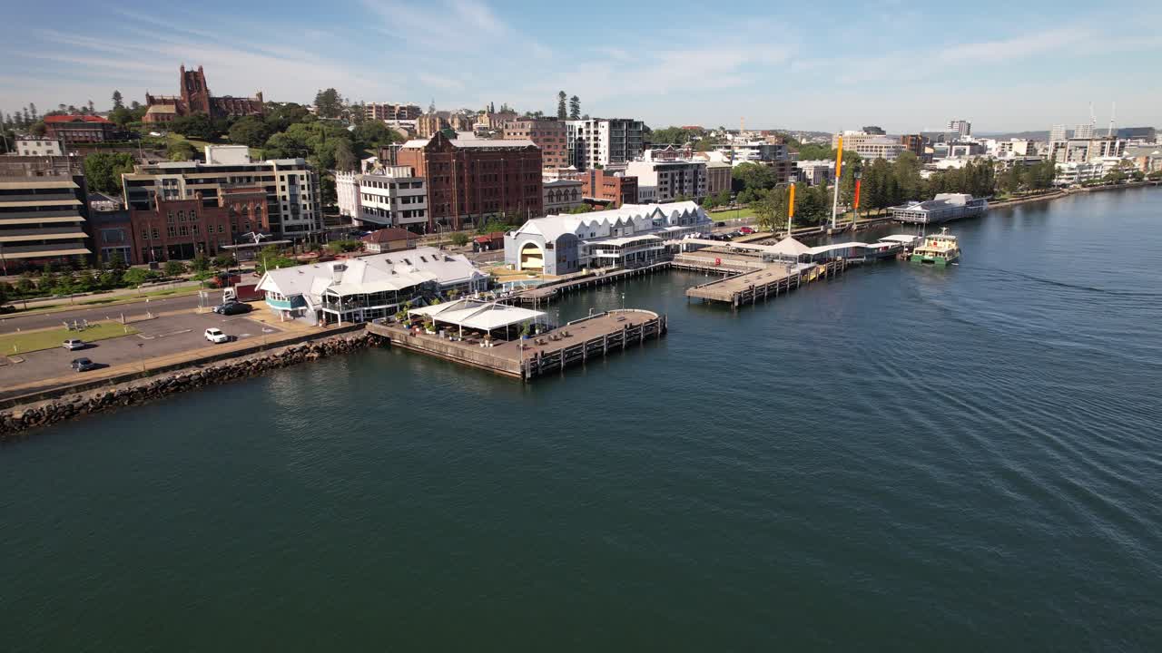 Ferry Terminal And Hotel On Hunter River In Newcastle, NSW, Australia. aerial shot