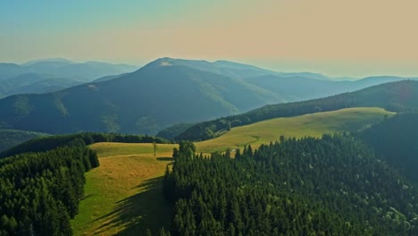 aerial drone footage view of carpathian mountains with a beautiful green meadow and hills