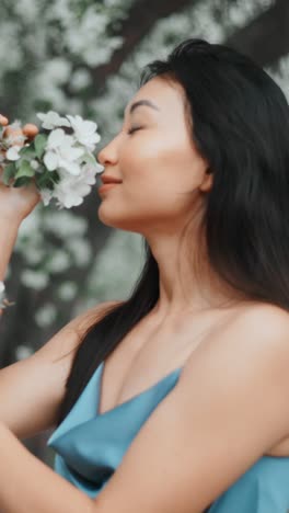 woman enjoying spring flowers