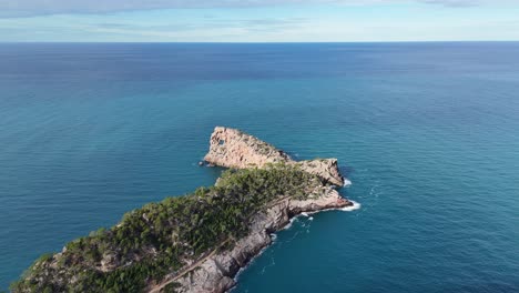 mirador de sa foradada in mallorca with lush greenery and blue sea, aerial view