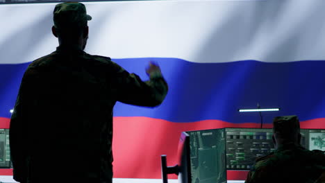 russian army soldier presenting the official salute in operations room