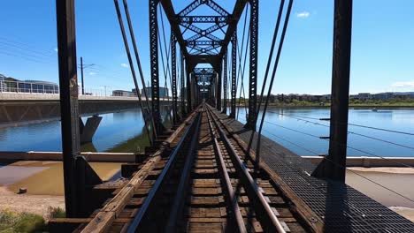 water from the salt river flows under the union pacific salt river bridge to create tempe town lake