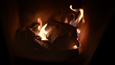a warm, glowing fire burns on logs in a cozy setting in zürich, switzerland