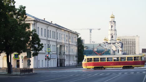 city street scene with tram and church