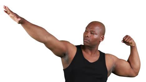 muscular man gesturing in front of camera