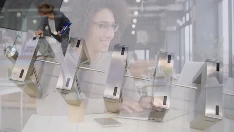 Animation-of-smiling-woman-using-laptop-in-cafe-over-businesswomen-passing-through-station-turnstile