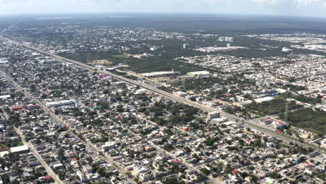 long superhighway road running through large city area in mexico