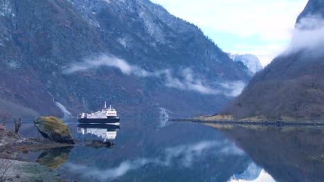 a ferry boat crosses the fjords of norway 2