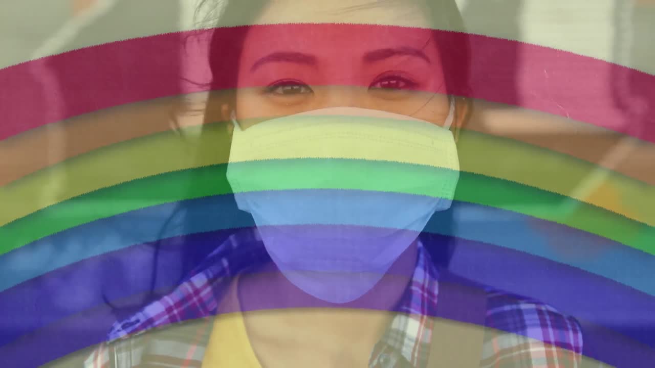 Rainbow against woman wearing face mask