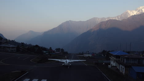 aeroplane taking off from lukla airport in nepal