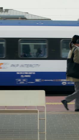 woman walking at train station