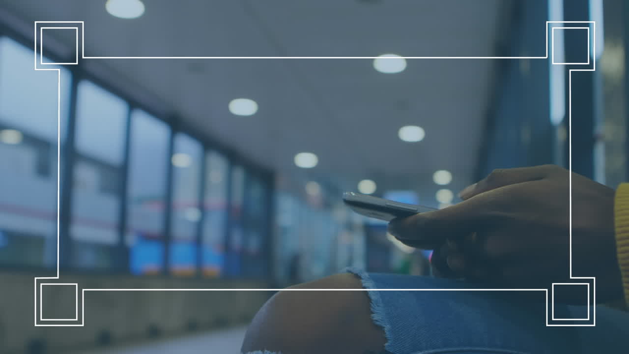 Animation of frame effect against mid section of a woman using smartphone