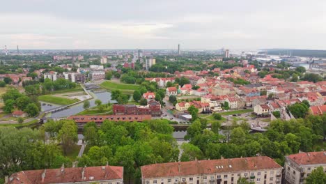 Establishing-panoramic-shot-of-Klaipeda-town-in-Lithuania,-ascending-shot