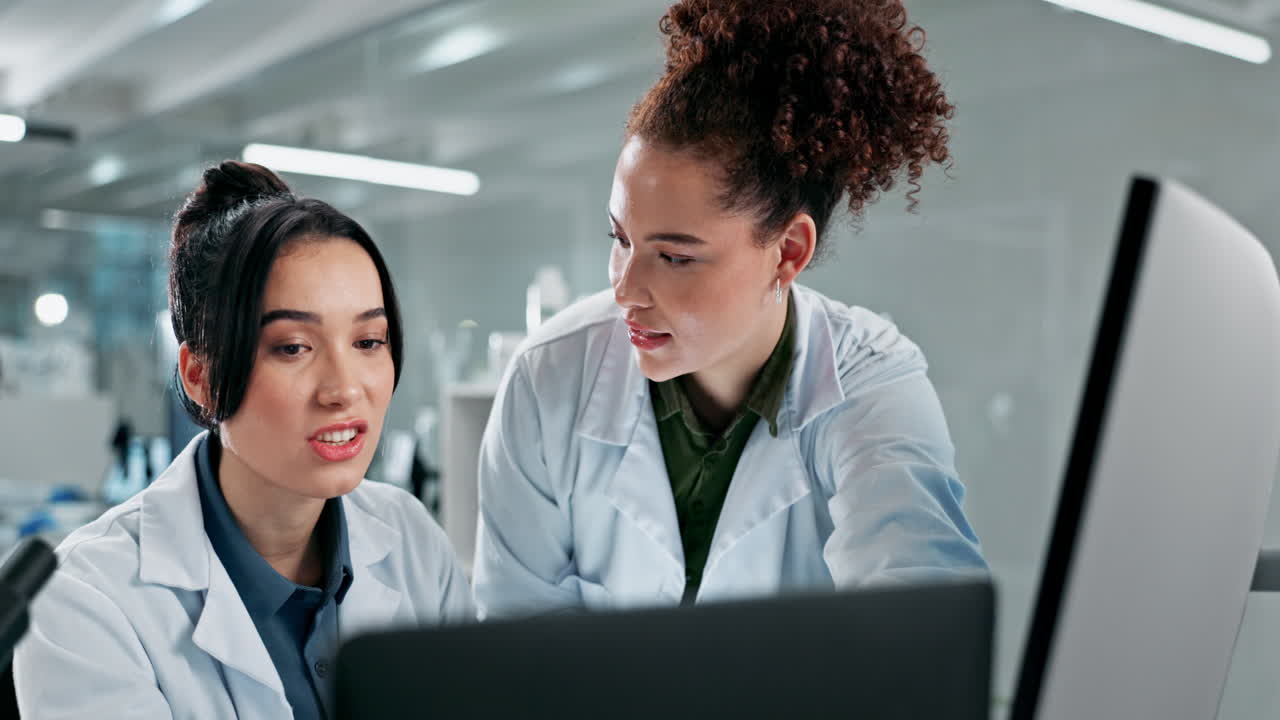 Scientists collaborating in the lab
