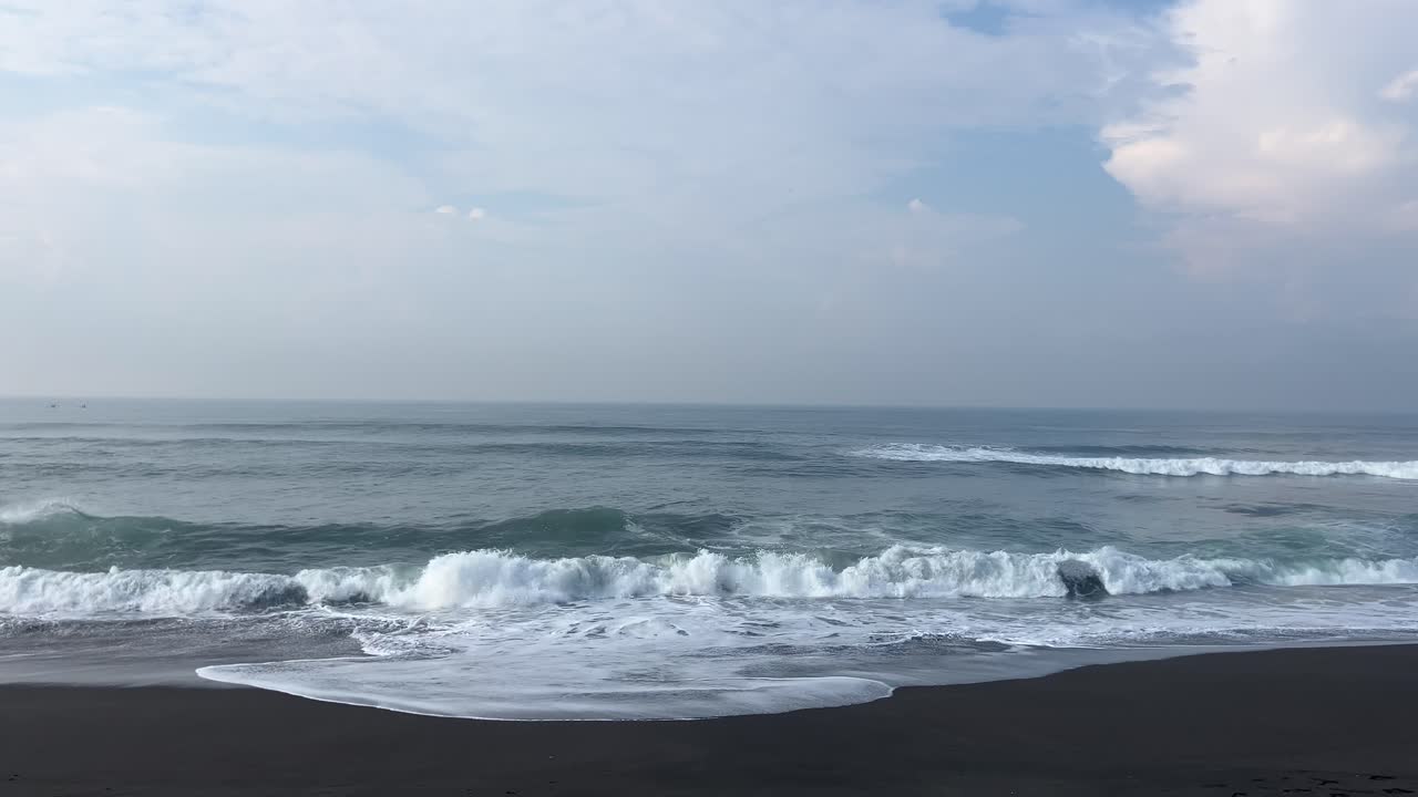 The best footage of calm and soothing ocean waves with beautiful sea water colors on a sunny day.